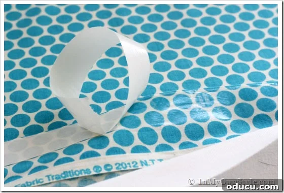 How to use HeatN Bond Adhesive by carefully peeling off paper backing.