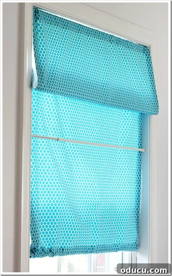 How to make a no-sew Roman Window Shade, showing the second fold being created.