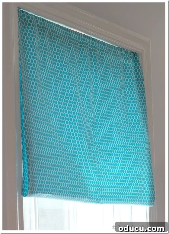 Tutorial No Sew Fabric Window Treatment showing unlined fabric hanging freely.