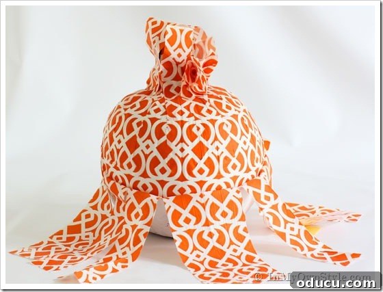 Pumpkin-decorating-tutorial Pumpkin-decorating-tutorial - Smoothing napkin strips on pumpkin.