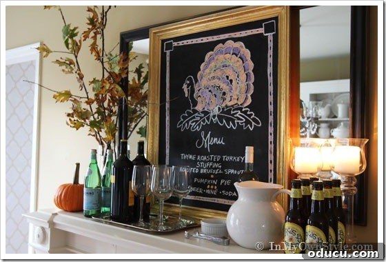 Dining room mantel sideboard Elegant dining room decorated for Thanksgiving, featuring unique chalkboard art and rustic touches.