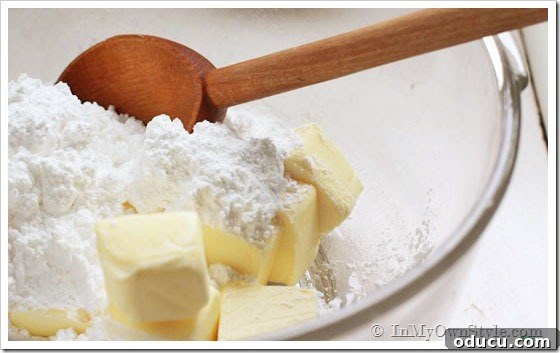 Cookies to Make Using Real Butter Mixing butter and flour together in a bowl for the cookie dough.