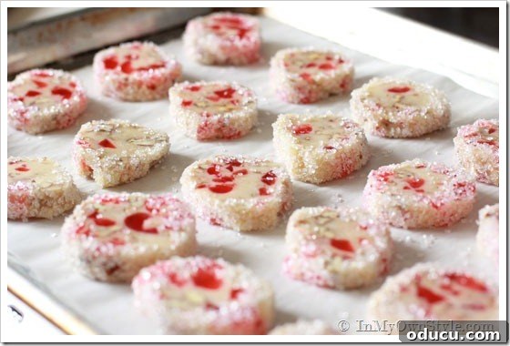 Easy Christmas Cookie Recipes - Oven Ready Pecan Cherry cookies on a parchment-lined cookie sheet, ready to be baked.