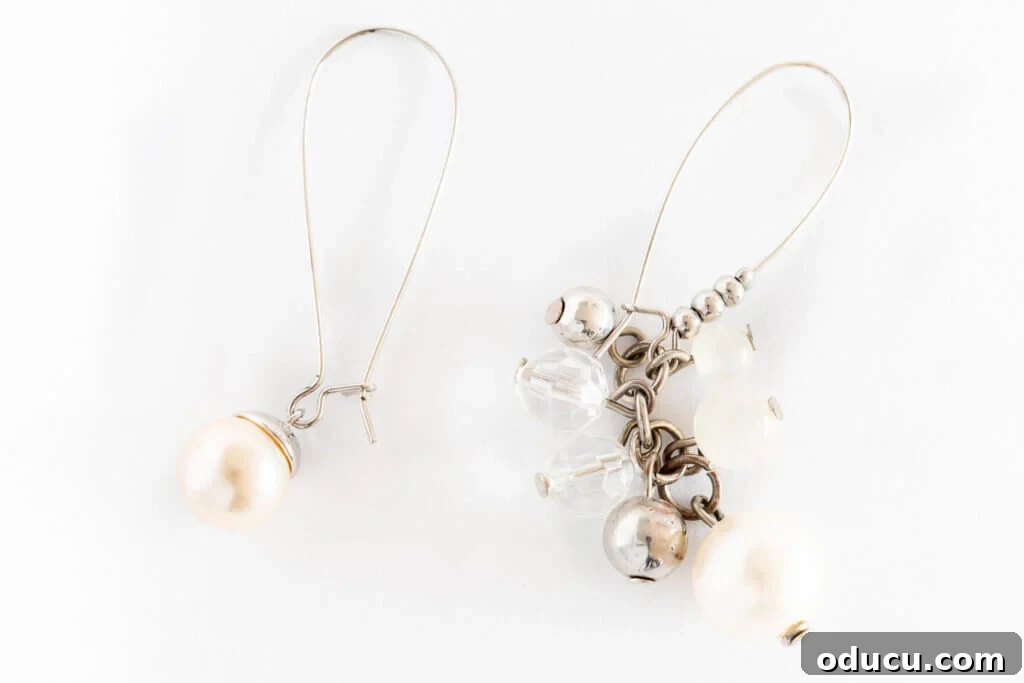 Craft Stunning Drop Dangles 2 a pair of pearl dangle earrings -on with only one bead and the other a cluster of pearl, silver and crystal beads.