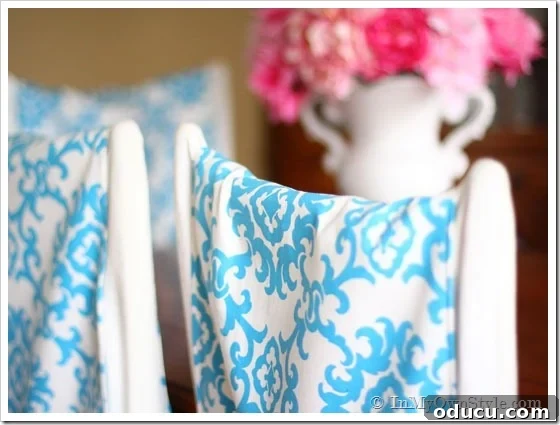 Chair covering ideas using fabric DIY chair back covers in turquoise and white on dining chairs in dining room