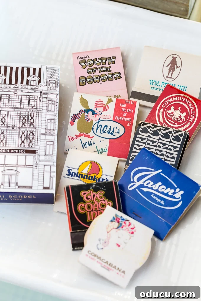 Curating Your Centerpiece Bowl 2 Collection of colorful matchbooks arranged on a decorative plate on a coffee table, showcasing unique home decorating ideas.