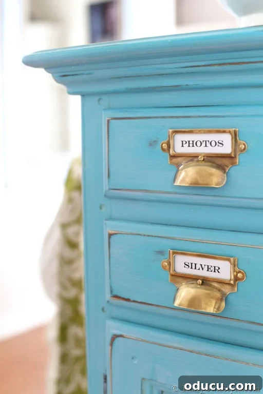 Instant Brass Patina: A 5-Minute Method 2 Turquoise chalk painted sideboard with aged brass card catalog style pulls, showcasing a beautiful furniture transformation.