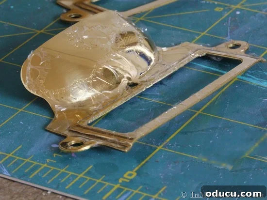 Instant Brass Patina: A 5-Minute Method 5 Gummy lacquer being removed from brass with acetone, showing the effectiveness of the process.