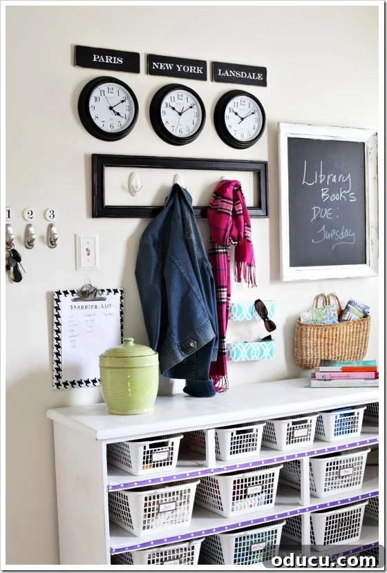 Mudroom-Ideas-for-Organizing Mudroom Wall Organization Ideas featuring a row of three clocks with custom city signs above them.