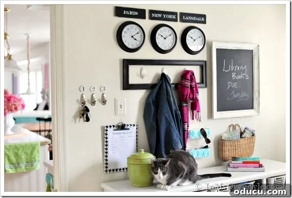 Foyer-organizing-and-Decorating Foyer Organizing and Decorating with a unified theme, using clocks and personalized signs.