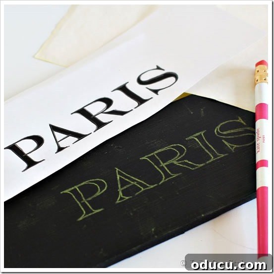 Paris-Sign Detailed view of a 'Paris' wall sign, demonstrating the painted lettering technique for DIY mudroom decor.