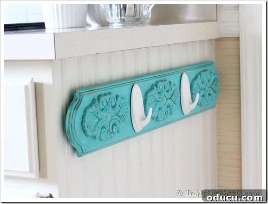Completed DIY Chalk Paint Kitchen Towel Rack Finished DIY Chalk Paint Kitchen Towel Rack with hanging dish towels, showcasing the complete project.