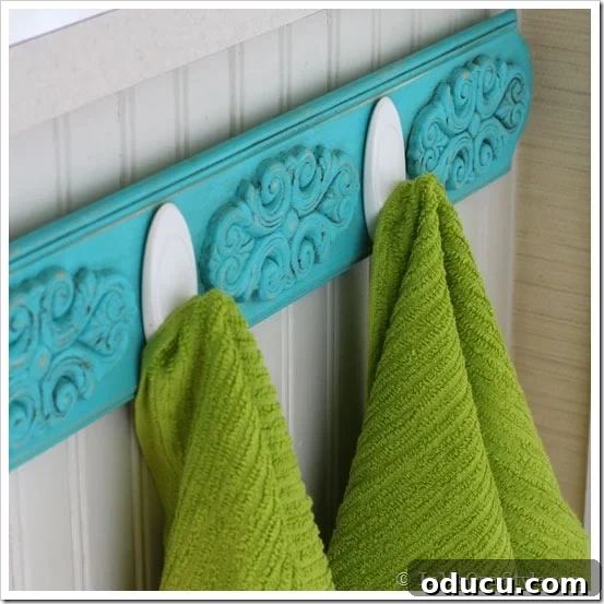 Towel Rack with Terrace Hooks and Towels Close-up of the chalk-painted towel rack with Command Brand Terrace Hooks holding dishtowels.
