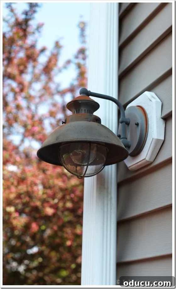 How-to-paint-rusted-metal Rusty outdoor light fixture on the side of a house, before restoration