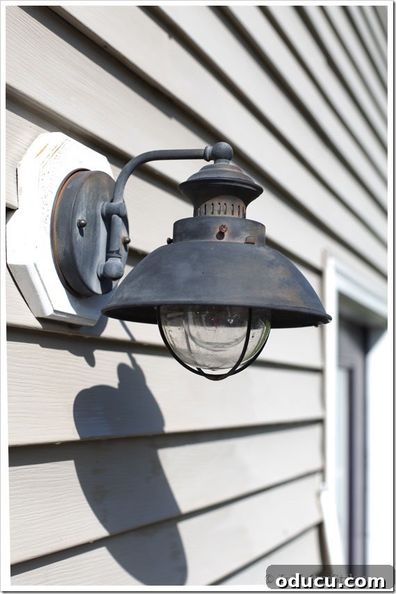 How-to-remove-rust-from-exterior-metal Outdoor light on side of house getting cleaned before painting to look new