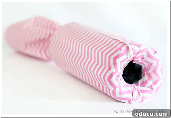 Gathering Supplies for Wine Bottle Gift Wrap Essential supplies for wrapping a wine bottle, including gift wrap, ribbon, and tools.