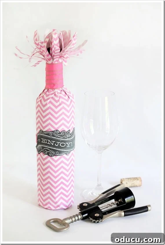 Elegant Wine Bottle Wrap for Any Occasion Finished wrapped wine bottle with a decorative ribbon and gift tag, perfect for a hostess.