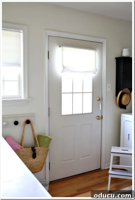 Customizable no-sew Roman shades perfect for any window or door, with any fabric choice. Finished no-sew Roman shade on a mudroom door