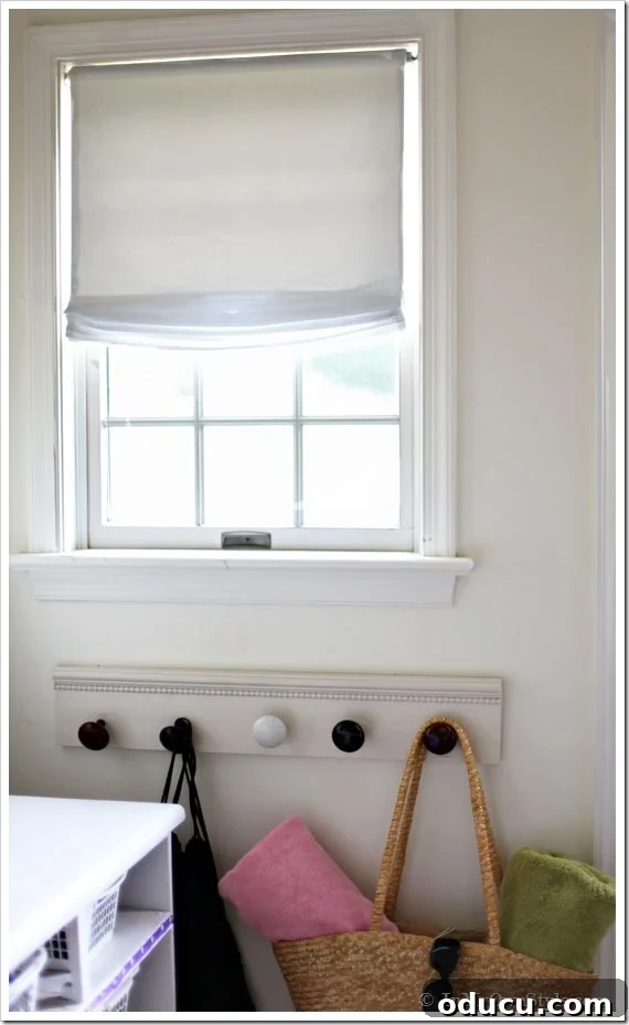 Learn how to effortlessly create stunning no-sew relaxed Roman shades for your home. No-sew relaxed Roman shade hanging beautifully on a mudroom window
