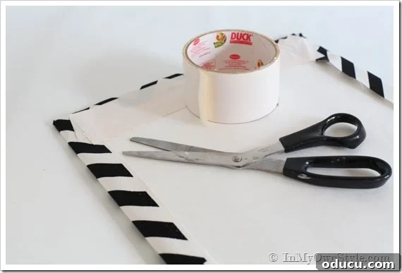 Transform Your Cabinet Door into a Smart Kitchen Message Center 4 how to attach fabric to a foam board to make a memo board for a kitchen cabinet