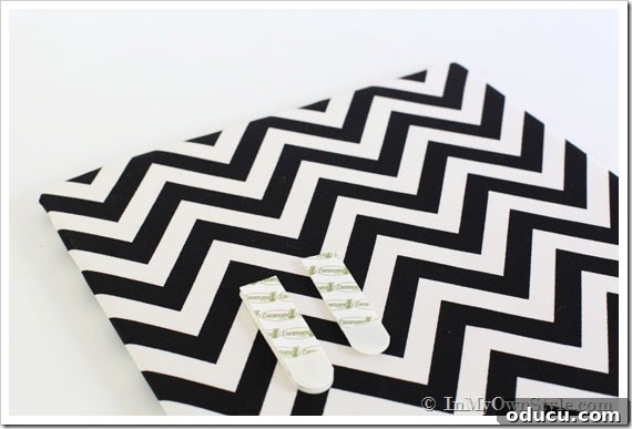 Transform Your Cabinet Door into a Smart Kitchen Message Center 5 Fabric wrapped foam showing where to put Command Brand strips to hang it on cabinet door.