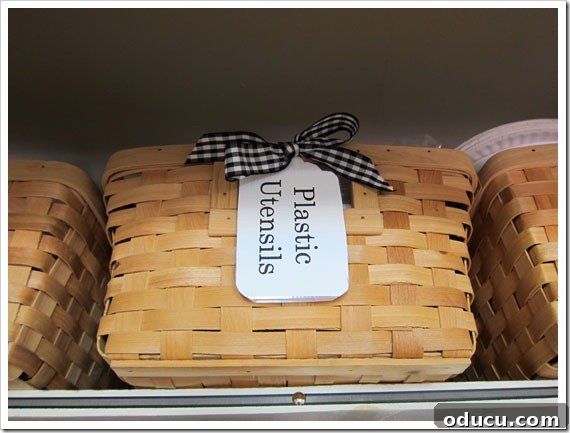 Organizing and storage idea Pantry-Organization-Ideas with flat reed baskets. Ribbon tied on label.