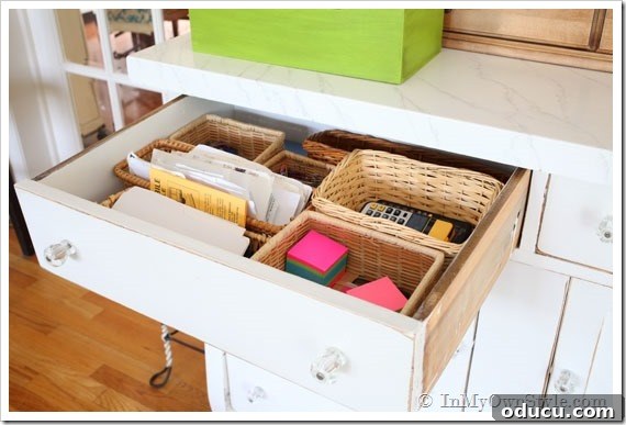 Kitchen-Organizing-Ideas Desk drawer with contents organized in small low sided baskets.