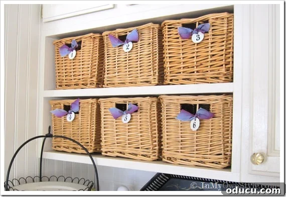 Baskets-in-kitchen for pretty storage Kitchen shelf Organizing Idea using a collection of the same basket.