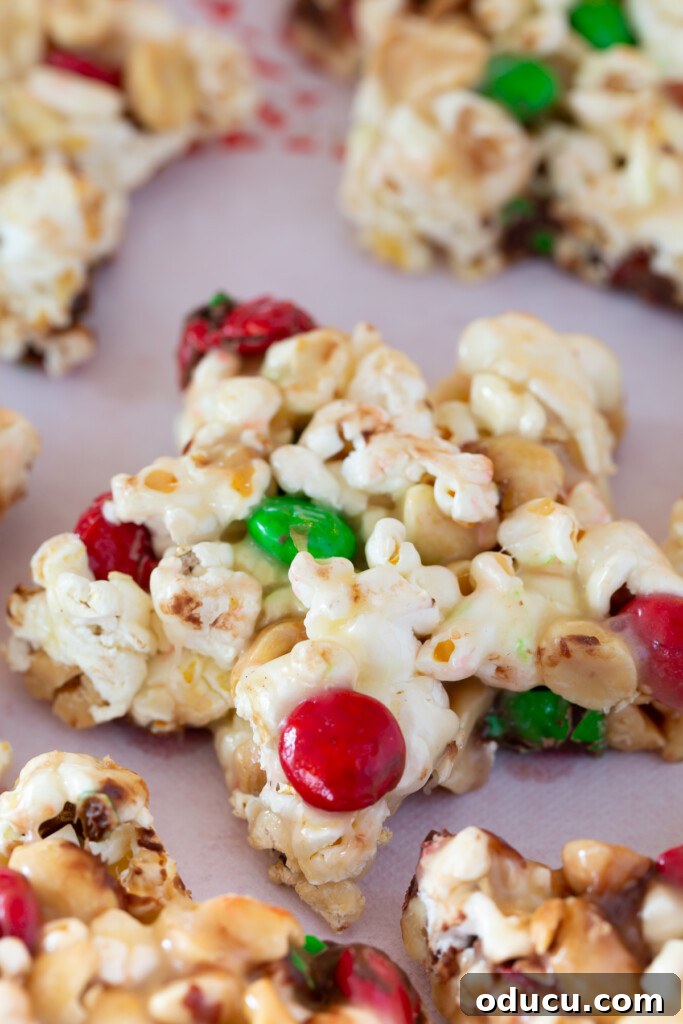 Festive Star Popcorn Cakes 2 Festive star-shaped popcorn cake adorned with M&M's, perfect for holiday gatherings and edible gifts.