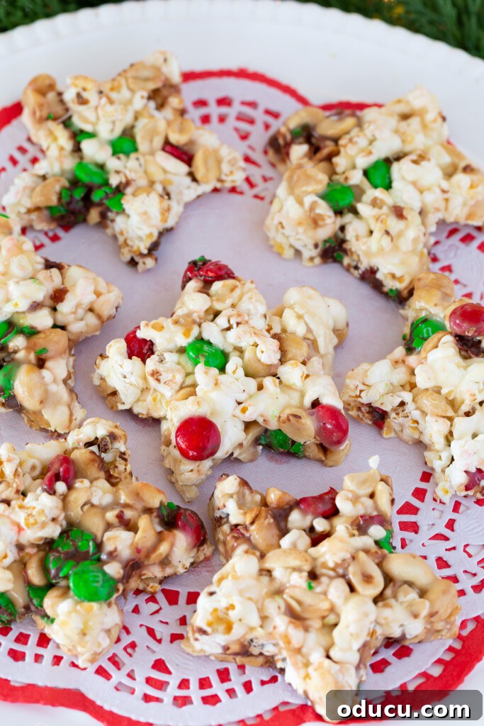 Festive Star Popcorn Cakes 8 A full tray of glistening Christmas popcorn cake stars, ready to be picked up and enjoyed by guests.