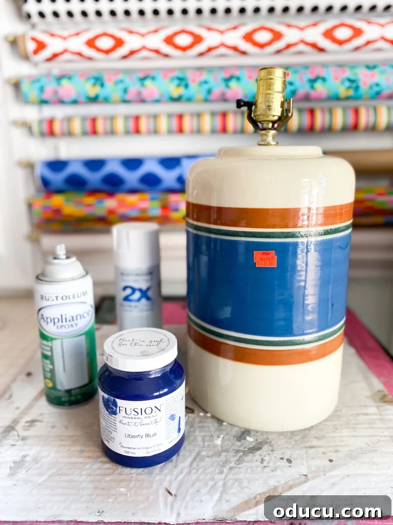 Thrifted Decorating Secrets Finding Your Home's Hidden Treasures 13 Thrift store table lamp and paints on table before getting painted.