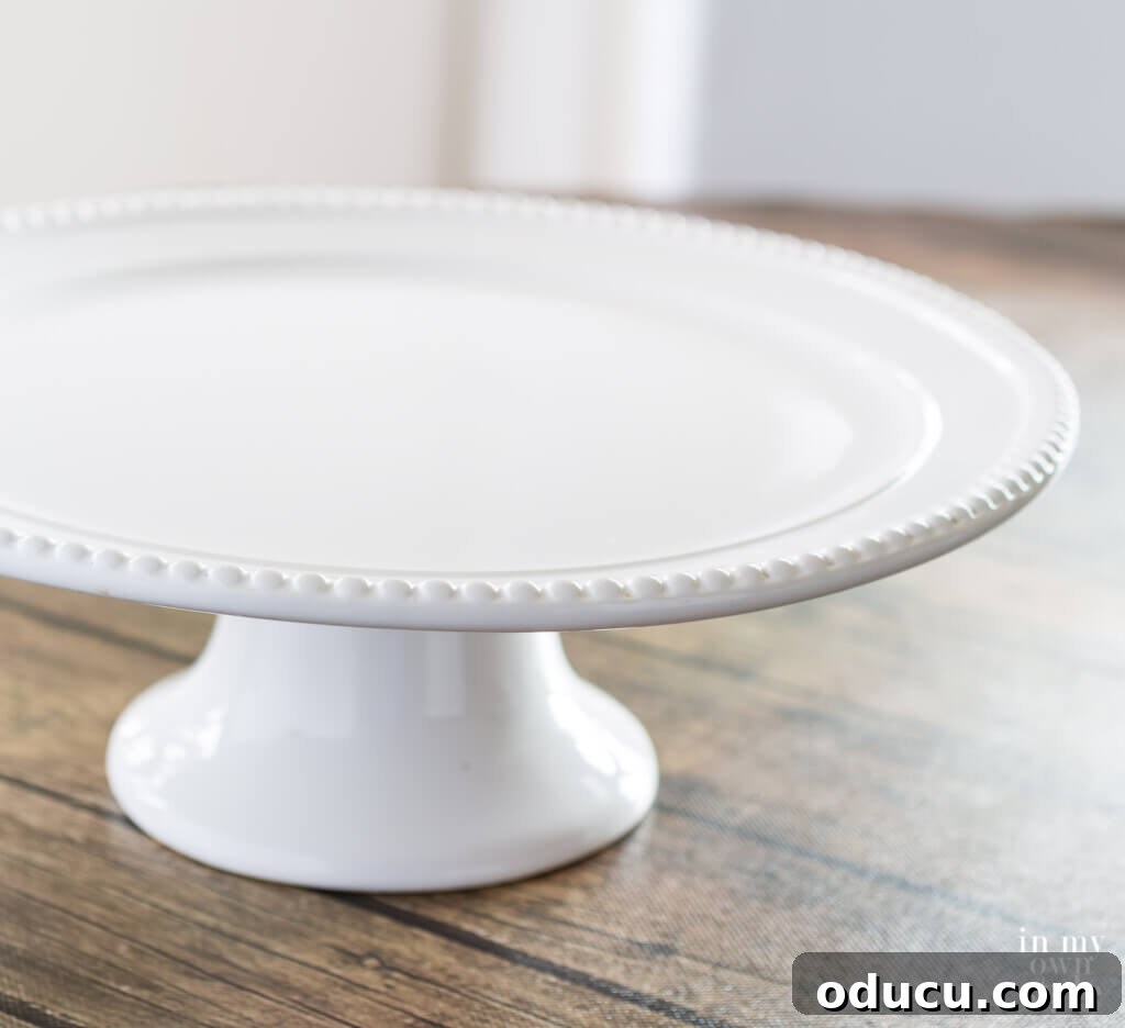 Thrifted Decorating Secrets Finding Your Home's Hidden Treasures 17 white cake plate with beaded edges can be repurposed for other uses.