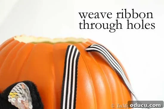 Whimsical Pumpkin Carving Ideas for Halloween 11 Weave ribbon through the holes in the pumpkin for handles