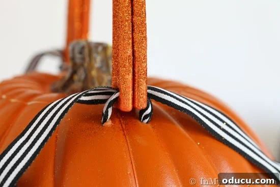 Whimsical Pumpkin Carving Ideas for Halloween 12 How to tie on ribbon to connect handle to pumpkin