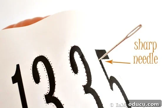 How to prepare street address numbers for pumpkin carving. Printed house address numbers template ready for transfer onto a foam pumpkin for carving.
