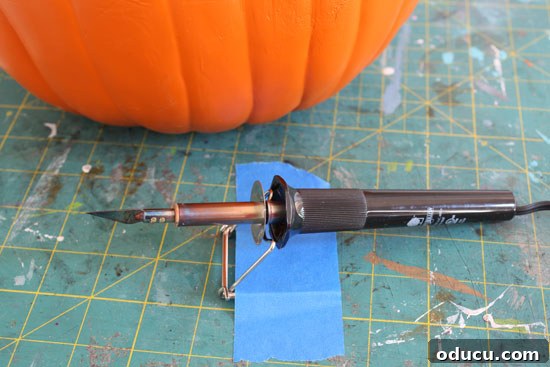 Expert advice on using a hot knife for detailed pumpkin carving. Detailed tips and techniques for carving foam pumpkins using a hot knife, ensuring safety and precision.
