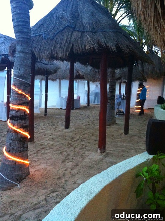 Romantic Beach Dining Tables Elegant beach tables set for a romantic dinner, providing an intimate dining experience by the sea.