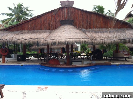 Relaxing Swim-Up Bar Inviting swim-up bar, a popular amenity at El Dorado Royale's pools, offering drinks and a social atmosphere.