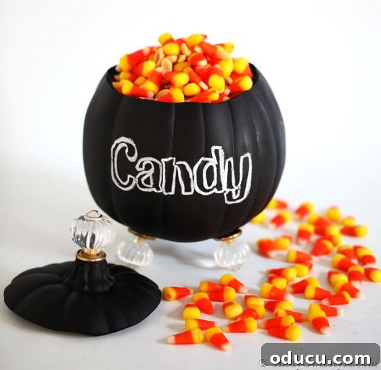 Side view of the finished pumpkin candy jar with all cabinet knob feet attached, resting stably.