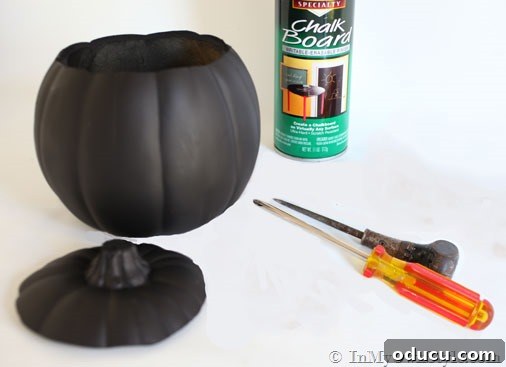 Foam pumpkin with its top cut off, demonstrating the first step in creating a candy jar.