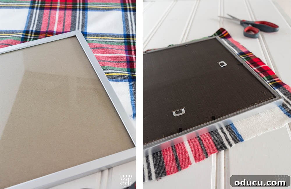 Upcycled Photo Frame Christmas Tree Skirt 7 Detailed image demonstrating the process of wrapping fabric smoothly and securely around photo frames, preparing them for the next step in creating the DIY Christmas tree collar.