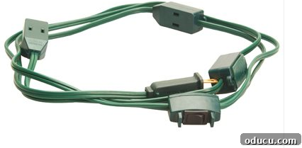 9 ft Christmas Tree Extension cord #HowtohanglightsonaChristmastree #Christmastreewithlights #Christmastreelighting #Christmastreelights #Christmastreewithlights #EasyChristmastreelights #HowdoyouwraplightsonaChristmastree A green 9-outlet Christmas tree cube tap extension cord, designed for convenient and safe Christmas tree lighting.