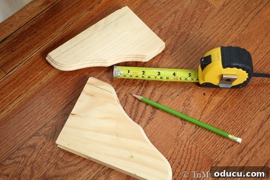 IMG_5253 decorative wood shelf brackets made into feet to kitchen cabinets