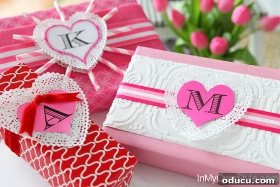 Heartfelt Initial Crafts: Free Valentine Printables 8 Valentine's gift wrapping ideas featuring free printable initial hearts, doilies, and paper straws for creative and personalized presents.