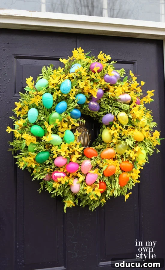 How to update an old wreath for a door by spray-painting and adding-Easter-eggs Spray painted Easter egg wreath showing an updated old wreath for a door