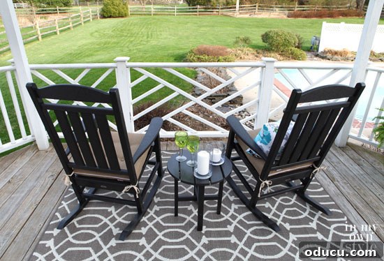 Polywood Presidential Rocker and Side Table: Unveiling Premium Outdoor Comfort 9 Black Polywood Presidential Rockers with Sunbrella Sesame cushions, complementing painted outdoor dining furniture