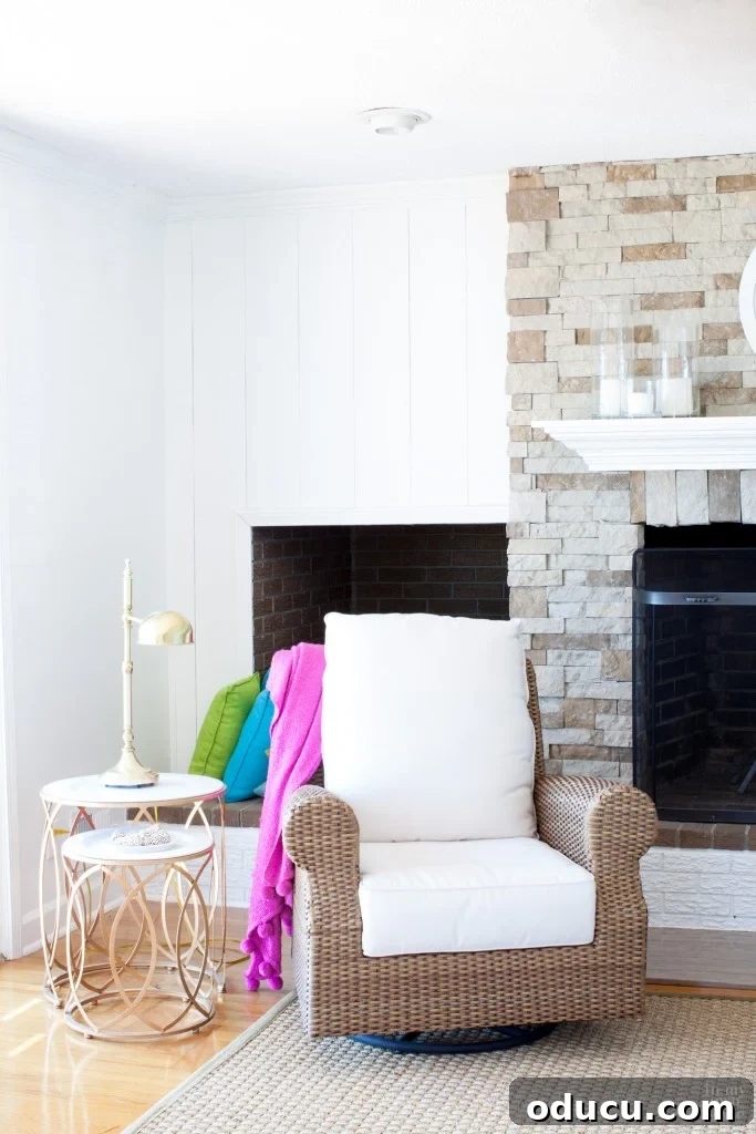 Valspar Bistro White Paint: Real Room Inspiration Gallery 9 Airstone fireplace in living room with glossy white trim and vertical panels to accent on either side painted in Valspar Bistro White.