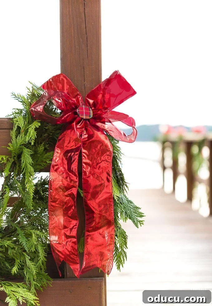 Ribbon Flair for Instant Home Style 22 Outdoor Christmas decorating idea using cedar roping and a vibrant red ribbon bow on a gazebo.
