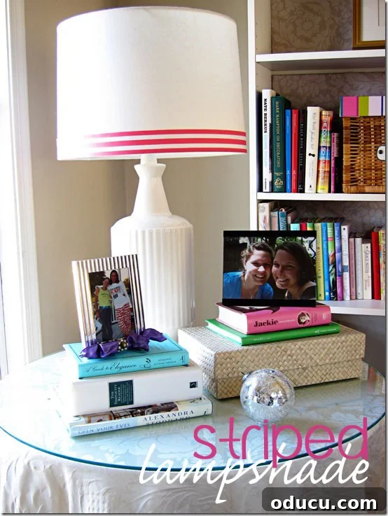 Ribbon Flair for Instant Home Style 7 Lamp on table with a plain lampshade decorated with striped pink and white ribbon along its bottom edge.