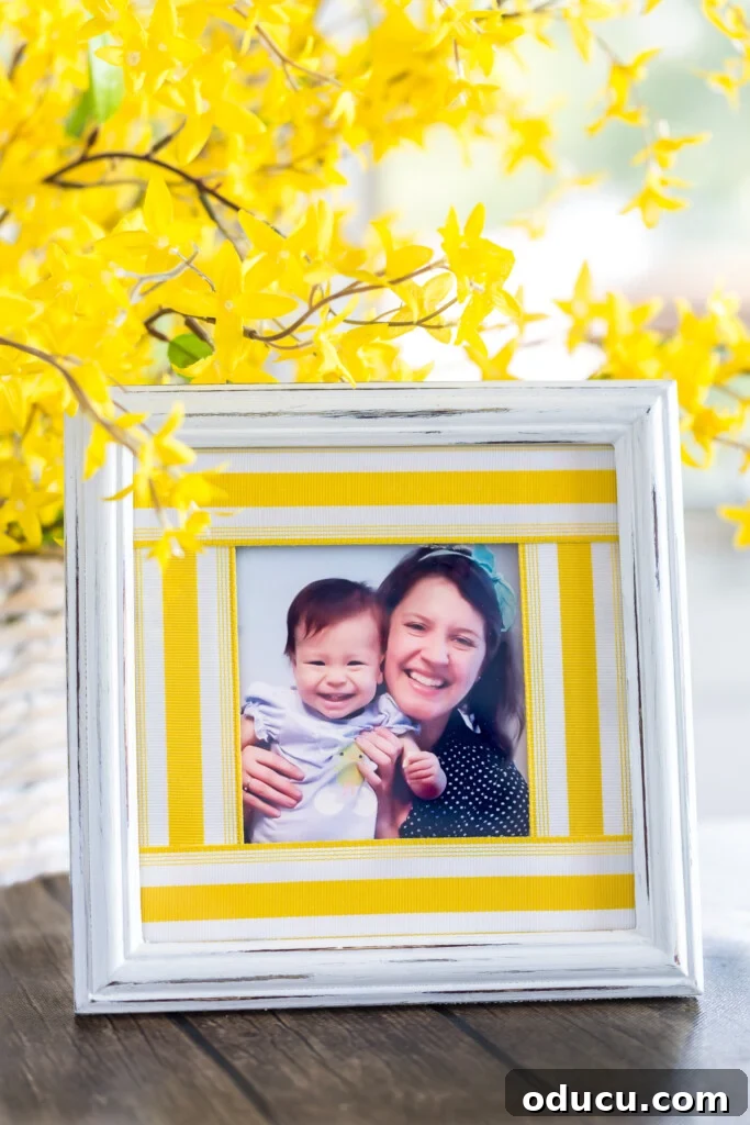 Ribbon Flair for Instant Home Style 10 White picture frame with a yellow stripe ribbon scrap picture frame mat, showcasing a pair of smiling girls.